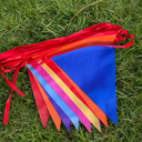 Bright festival-coloured bunting on grass