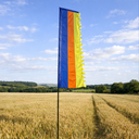 Tall festival flag crafted from recycled polyester in a field