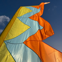 Recycled festival flag outdoor display with flowing fabric