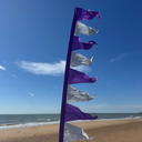 Tall festival flag used as outdoor event decoration
