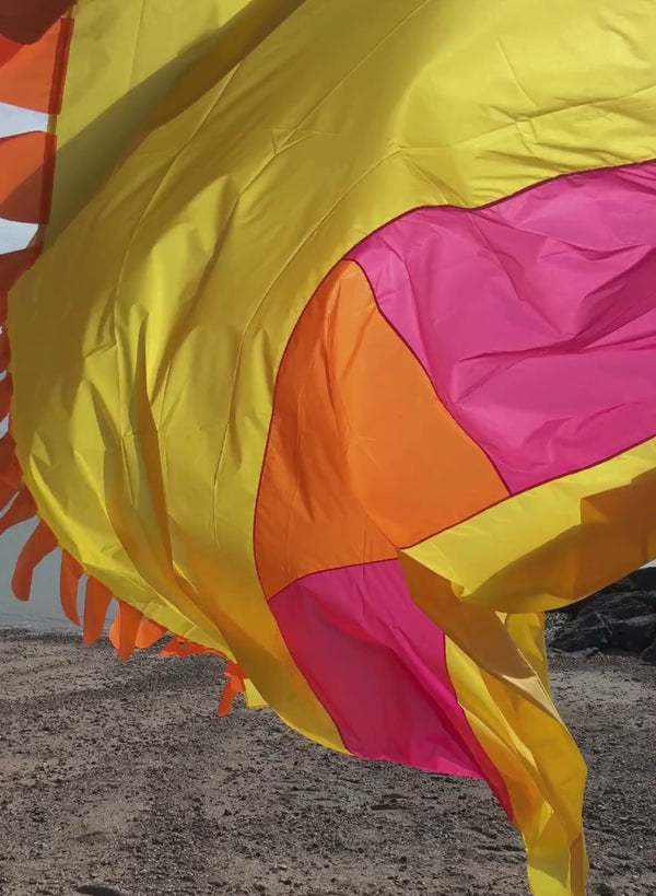 Festival flag displayed blowing in the wind