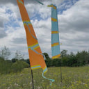 Festival flag product shown in two different colourways 